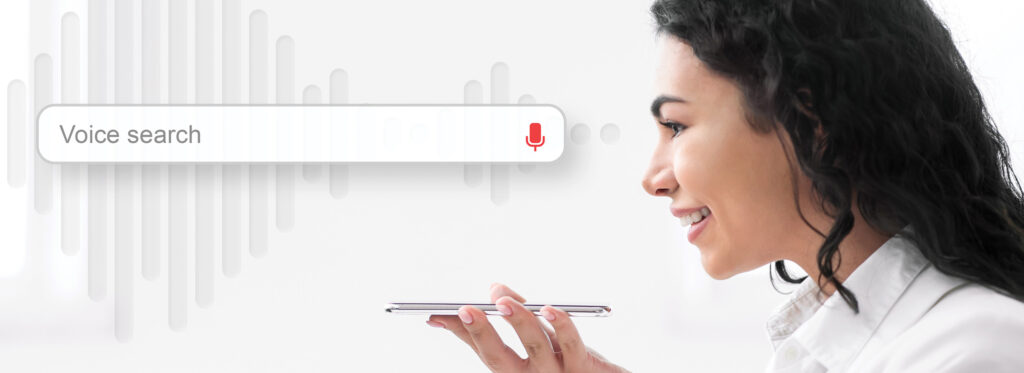 a woman using the voice search function